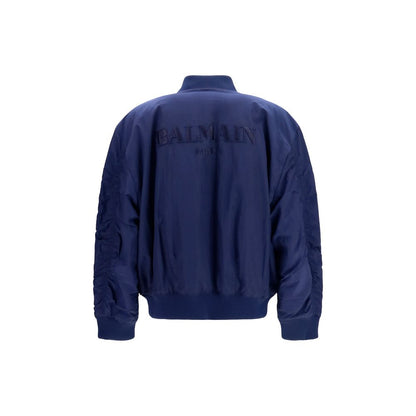 Bomber Jacket by Balmain for men in nylon blue features a dramatic silhouette, showcasing a sophisticated and distinctive pockets for a dramatic aesthetic.