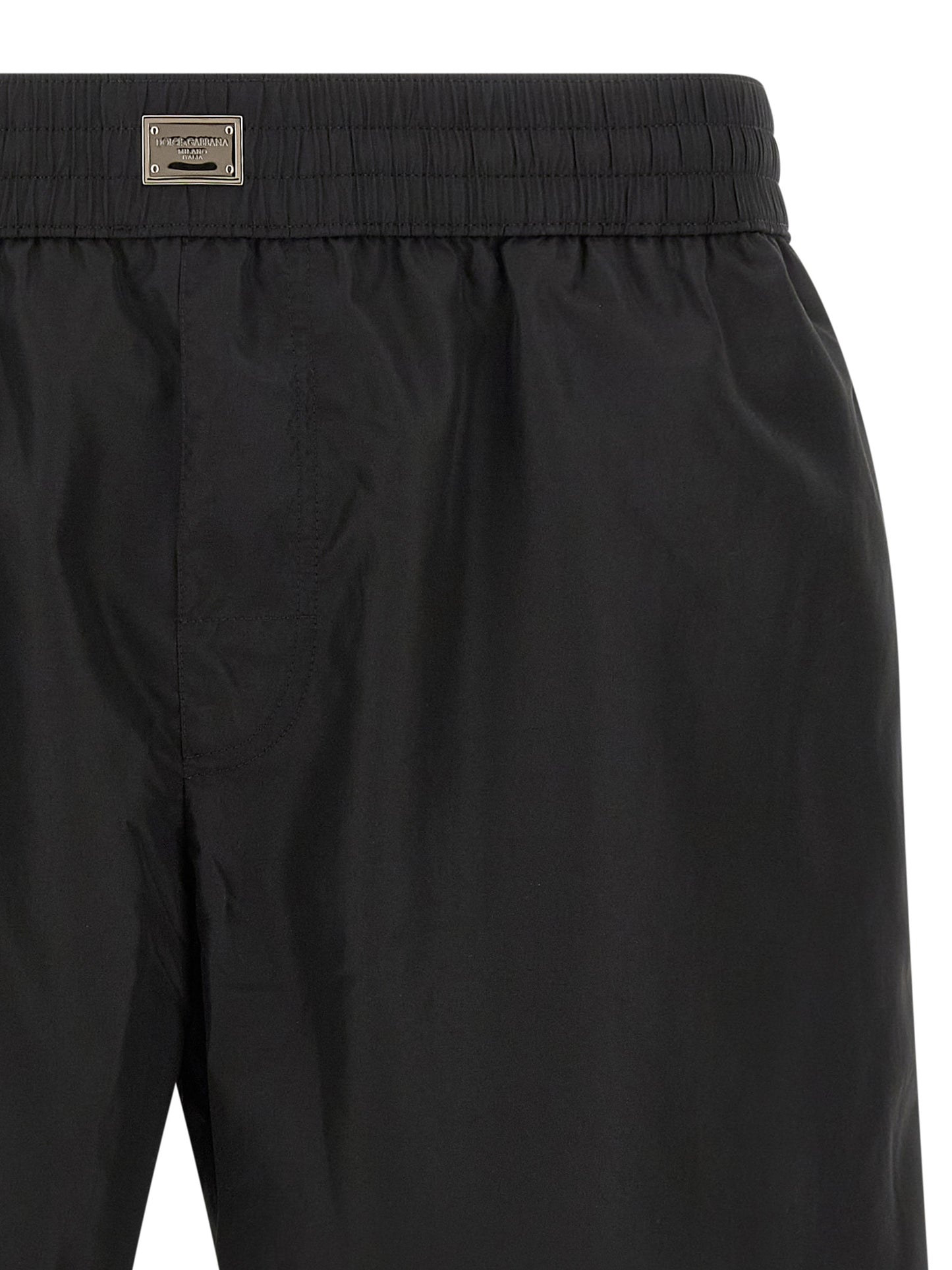 Swim Shorts by Dolce & Gabbana for men in stretch nylon black showcases a contemporary silhouette, artfully capturing the essence of the contemporary Men's Stretch Nylon Swim Shorts design for a sophisticated look.