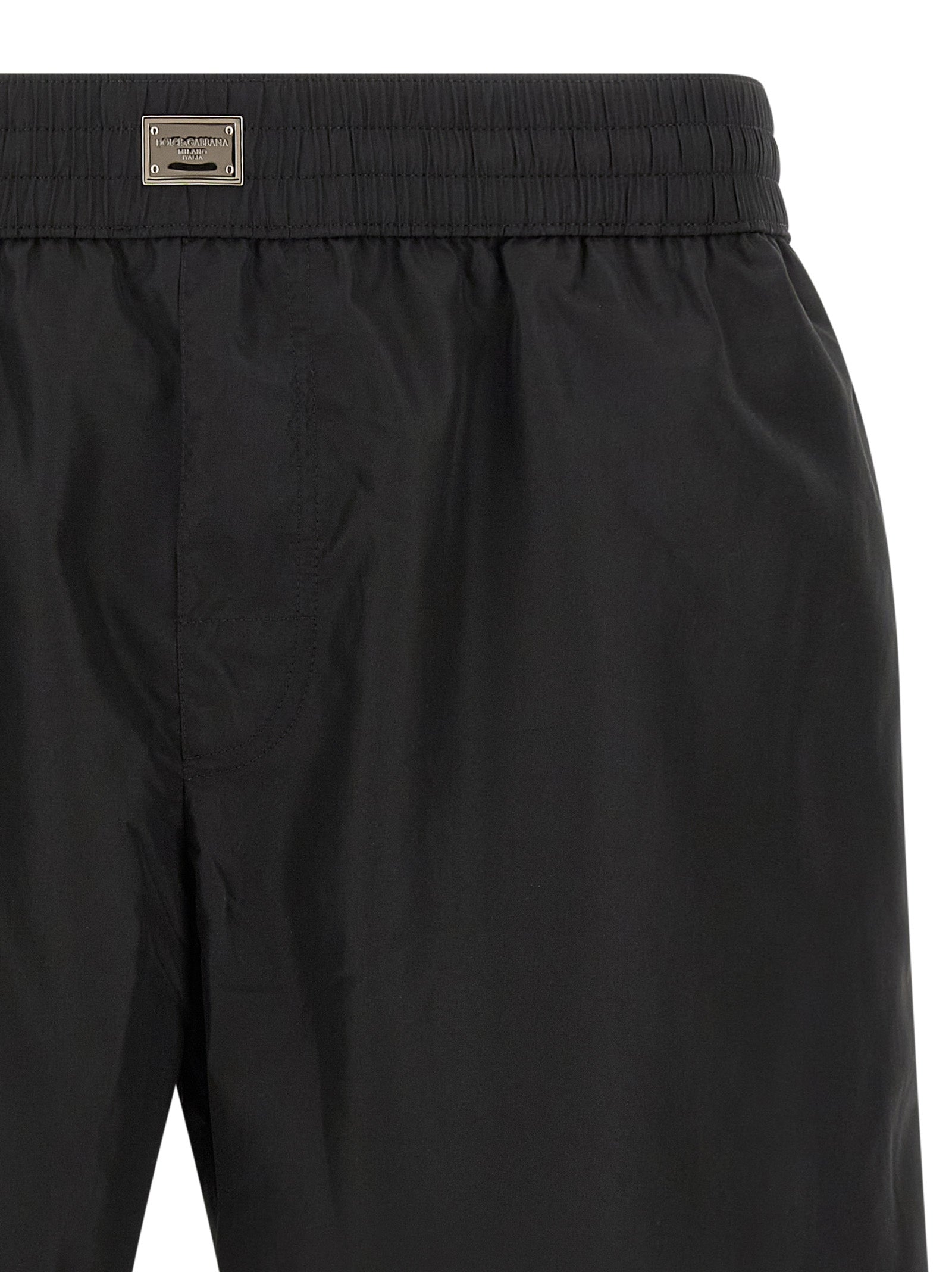 Swim Shorts by Dolce & Gabbana for men in stretch nylon black showcases a contemporary silhouette, artfully capturing the essence of the contemporary Men's Stretch Nylon Swim Shorts design for a sophisticated look.