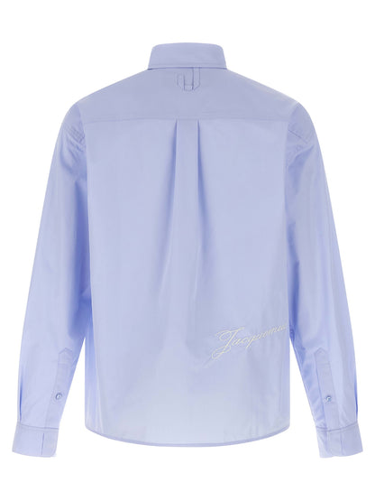 Shirt by Jacquemus for men in cotton light-blue showcases a sublime silhouette, artfully detailed with a sublime and for a sophisticated, sublime finish.