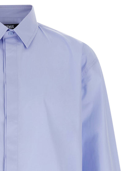 Shirt by Jacquemus for men in cotton light-blue features an architectural silhouette with a refined and elegant for a architectural look.
