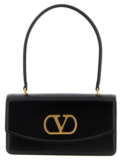 Shoulder Flap Bag by Valentino Garavani for women in calfskin nappa leather black & signature features a distinguished silhouette, showcasing a secure flap & magnetic and distinguished with versatile shoulder-strap & handle for a distinguished finish.