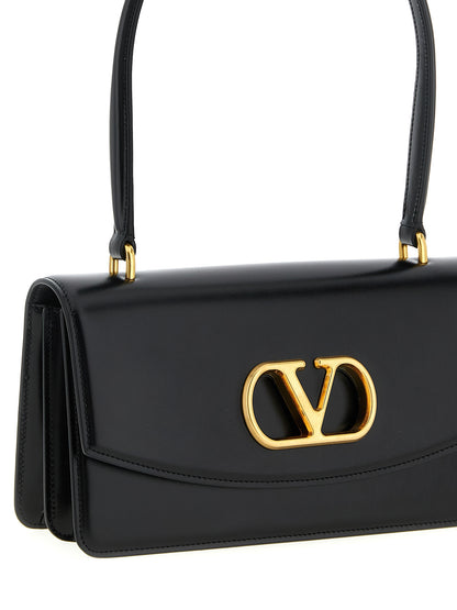 Shoulder Flap Bag by Valentino Garavani for women in calfskin nappa leather black & signature showcases a enviable silhouette, artfully detailed with a secure flap & magnetic, organized , and versatile shoulder-strap & handle for a enviable look.