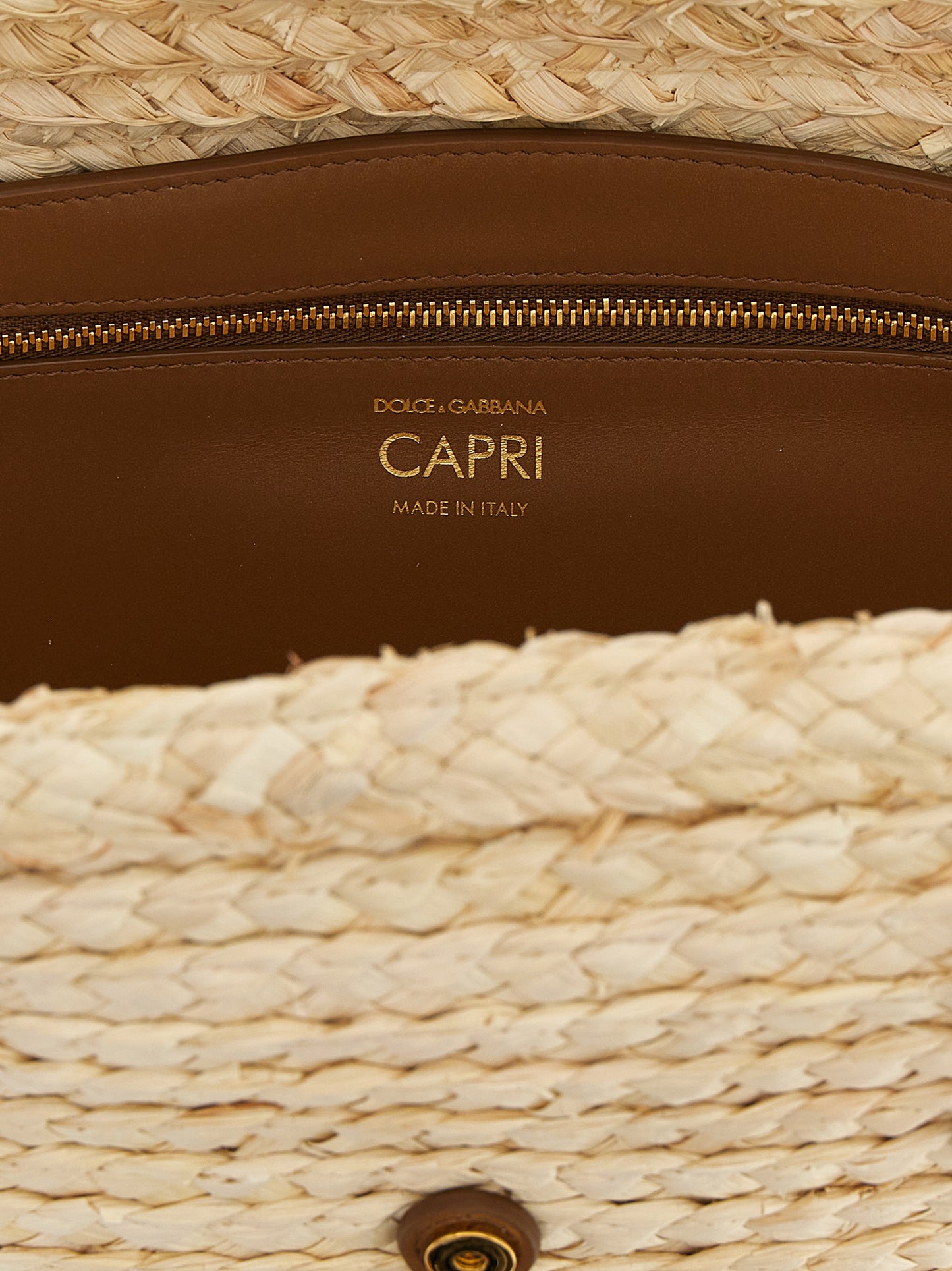 Shoulder Clutch Bag by Dolce & Gabbana for women in leather & cashmere beige showcases a statuesque silhouette, artfully detailed with a secure magnetic & buckle, organized , and versatile shoulder-strap & handle for a statuesque look.