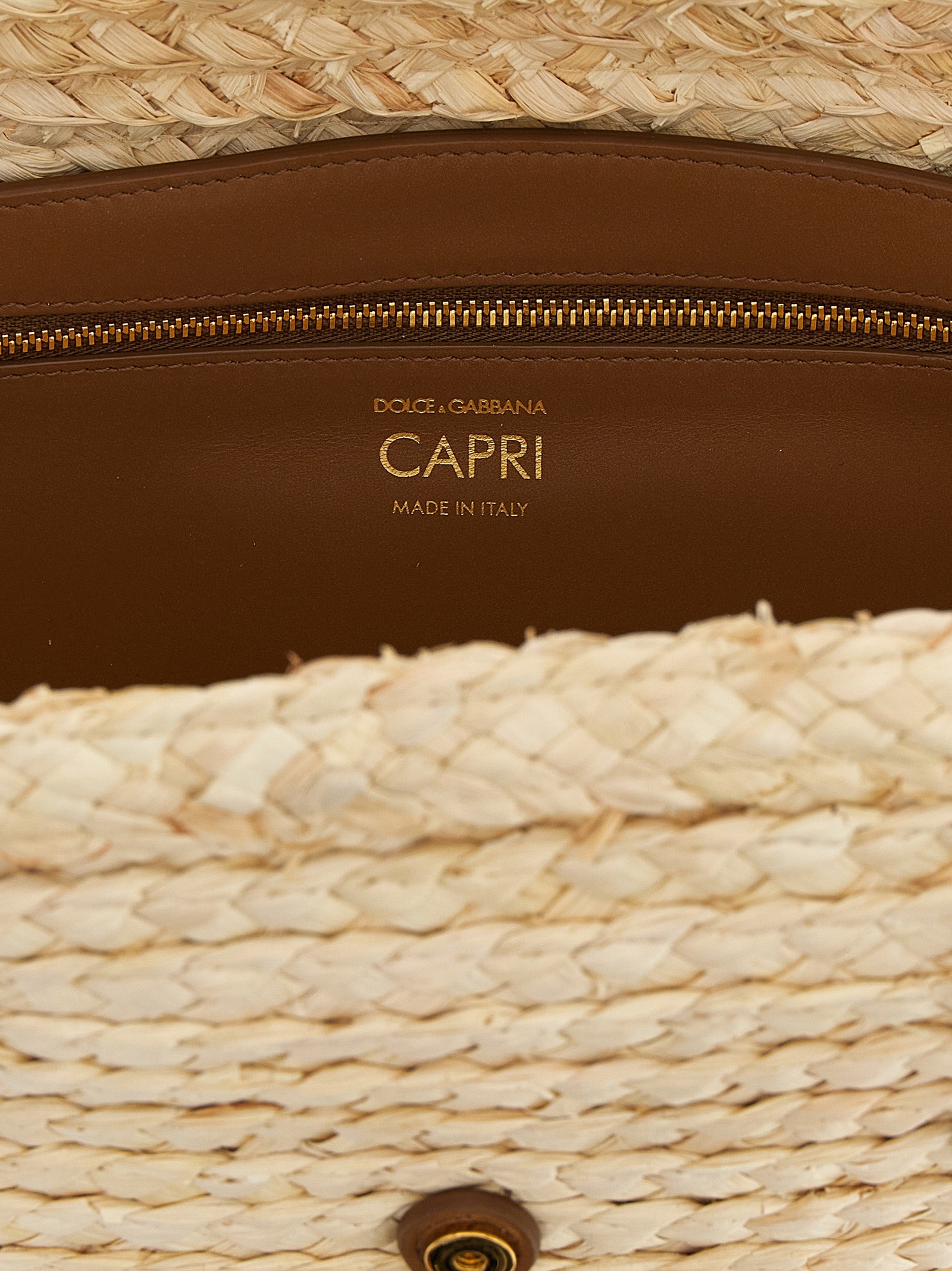 Shoulder Clutch Bag by Dolce & Gabbana for women in leather & cashmere beige showcases a statuesque silhouette, artfully detailed with a secure magnetic & buckle, organized , and versatile shoulder-strap & handle for a statuesque look.