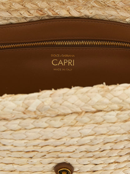 Shoulder Clutch Bag by Dolce & Gabbana for women in leather & cashmere beige showcases a statuesque silhouette, artfully detailed with a secure magnetic & buckle, organized , and versatile shoulder-strap & handle for a statuesque look.