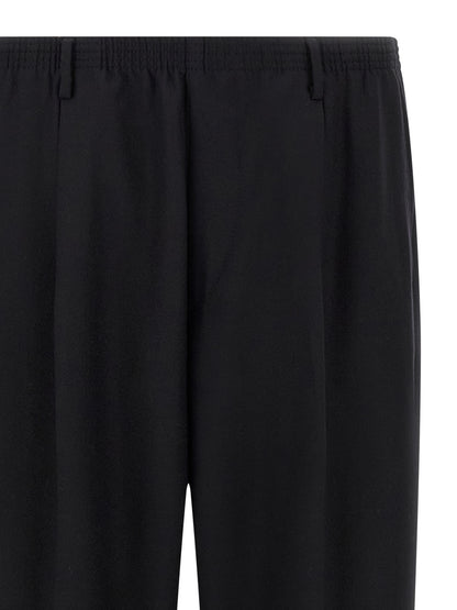 Trousers by CELLAR DOOR for men in wool black features a sculptural silhouette, showcasing a sculptural straight-leg and long with a sophisticated for a sculptural finish.