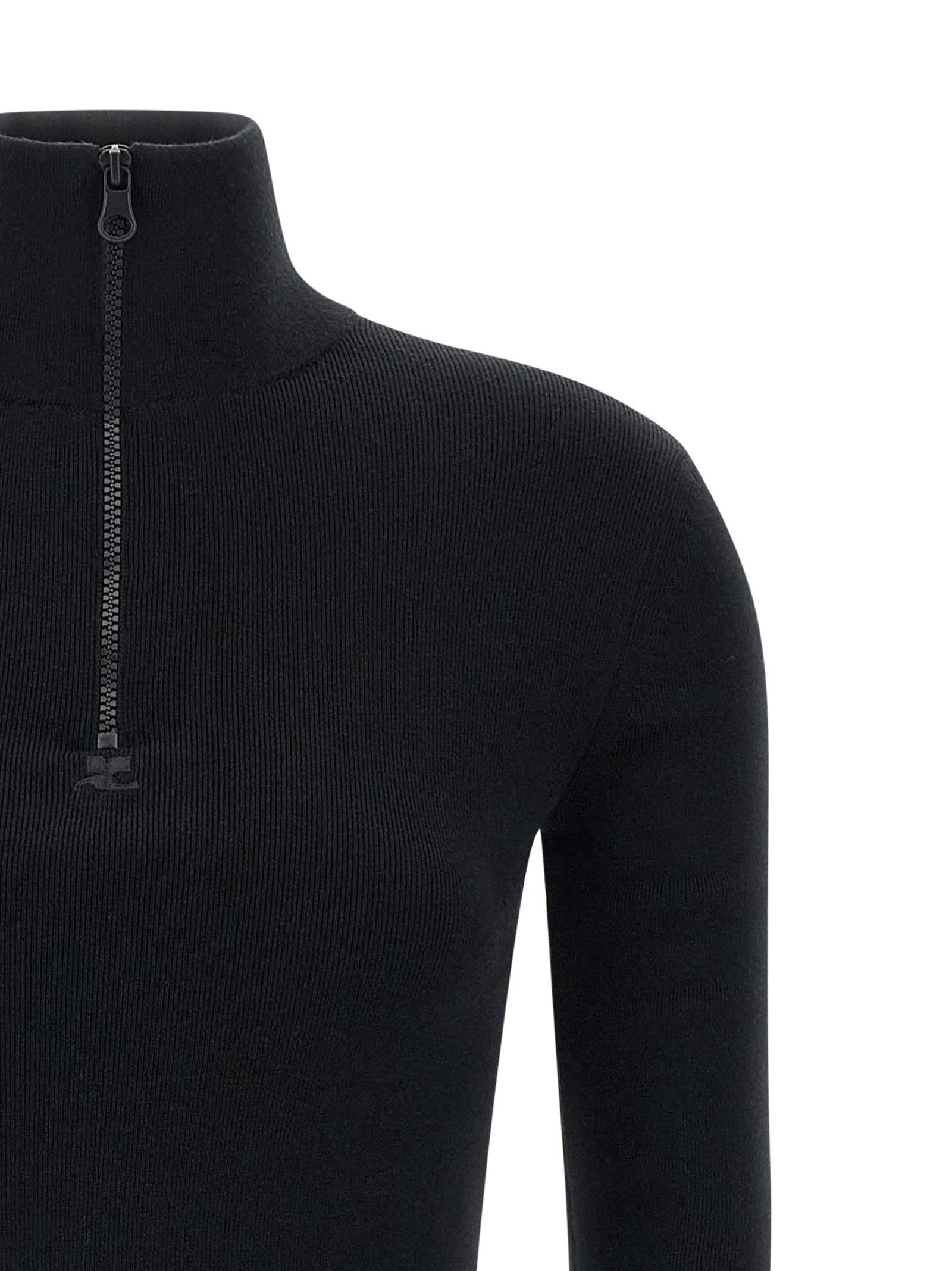 Dress by Courrèges for women in merino wool black features an eye catching silhouette with a sophisticated , elegant , and a refined short mini for a eye catching aesthetic.