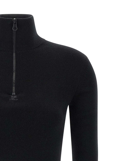 Dress by Courrèges for women in merino wool black features an eye catching silhouette with a sophisticated , elegant , and a refined short mini for a eye catching aesthetic.