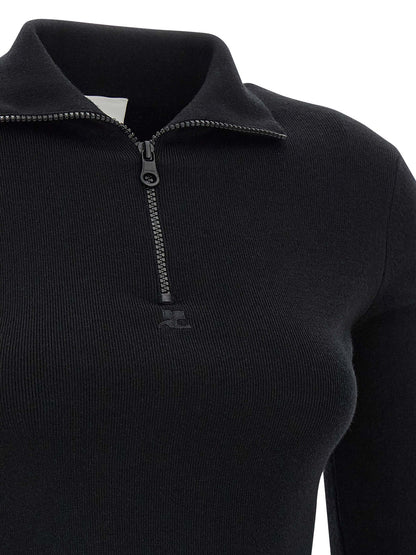 Dress by Courrèges for women in merino wool black features an cute silhouette, detailed with a and that elegantly flows into a cute short mini.