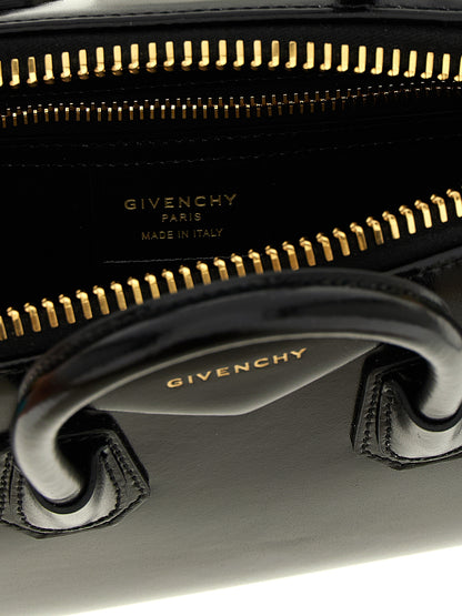Mini Evening Handbag by Givenchy for women in calfskin leather black & silver features a contemporary silhouette, showcasing a secure , ample , and contemporary shoulder-strap, handle & detachable-strap for a sophisticated look.