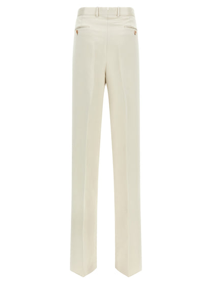 Trousers by Tom Ford for men in cotton silk & iron beige presents a perennial silhouette, meticulously tailored with a straight-leg cut, long finish, and an elegant .