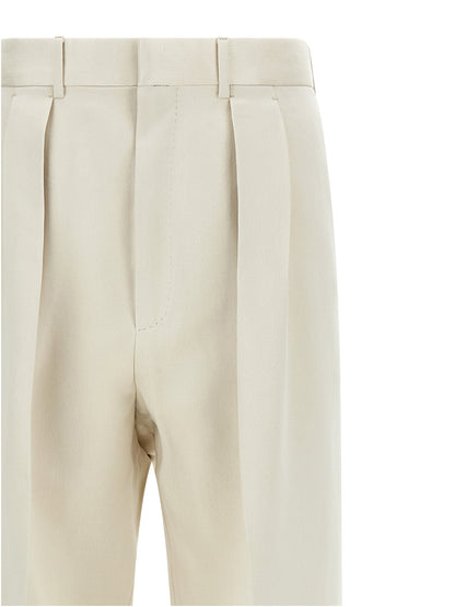 Trousers by Tom Ford for men in cotton silk & iron beige presents a smart silhouette, meticulously detailed with a smart straight-leg, a smart long, and a smart .