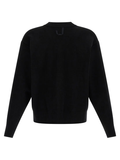 Cardigan by Jacquemus for men in polyamide & merino wool black showcases a captivating silhouette, artfully detailed with a captivating and v-neck neckline for a truly sophisticated captivating look.