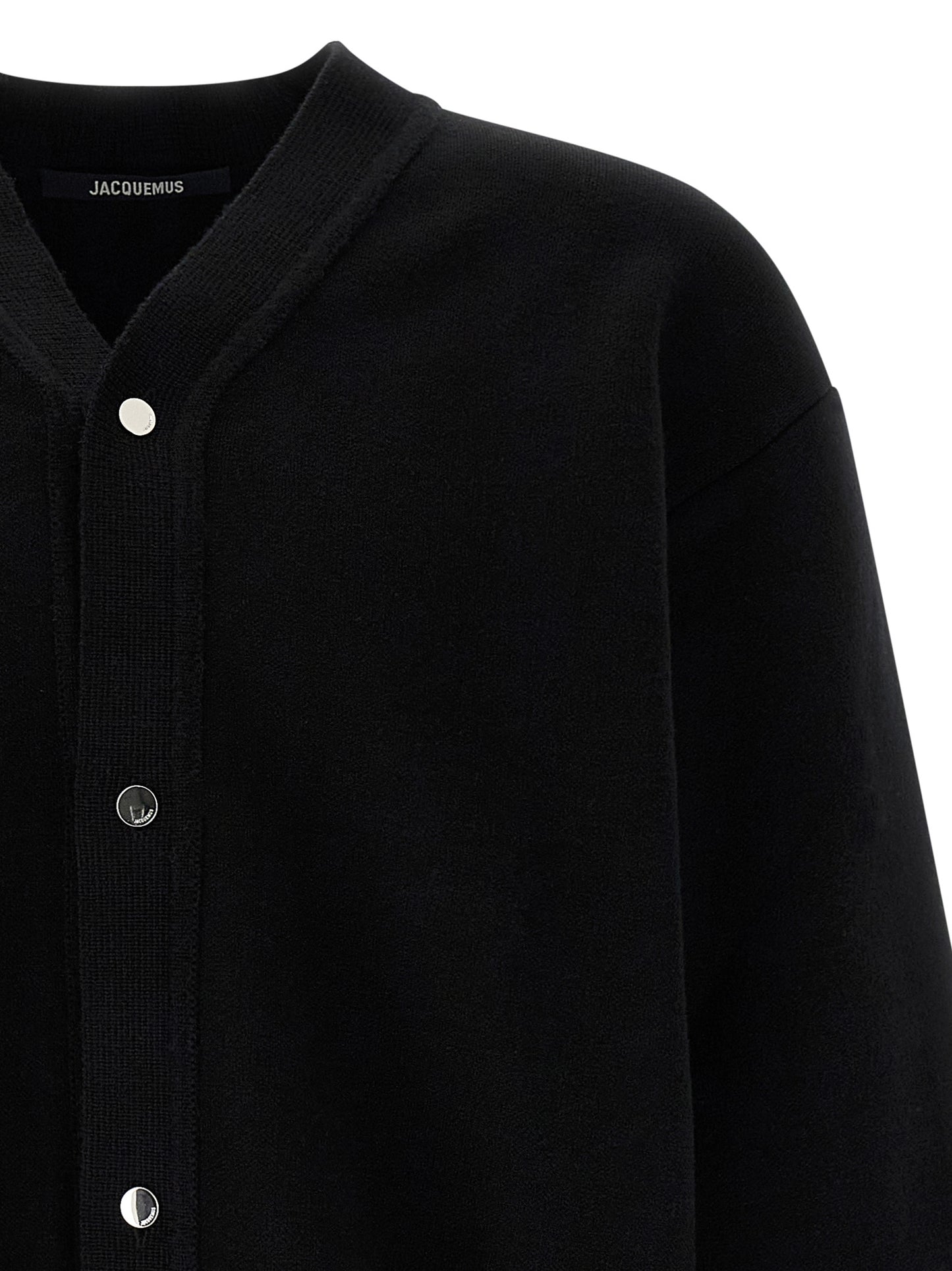 Cardigan by Jacquemus for men in polyamide & merino wool black features a nuanced silhouette with a refined v-neck neckline and nuanced detailing for a sophisticated look.
