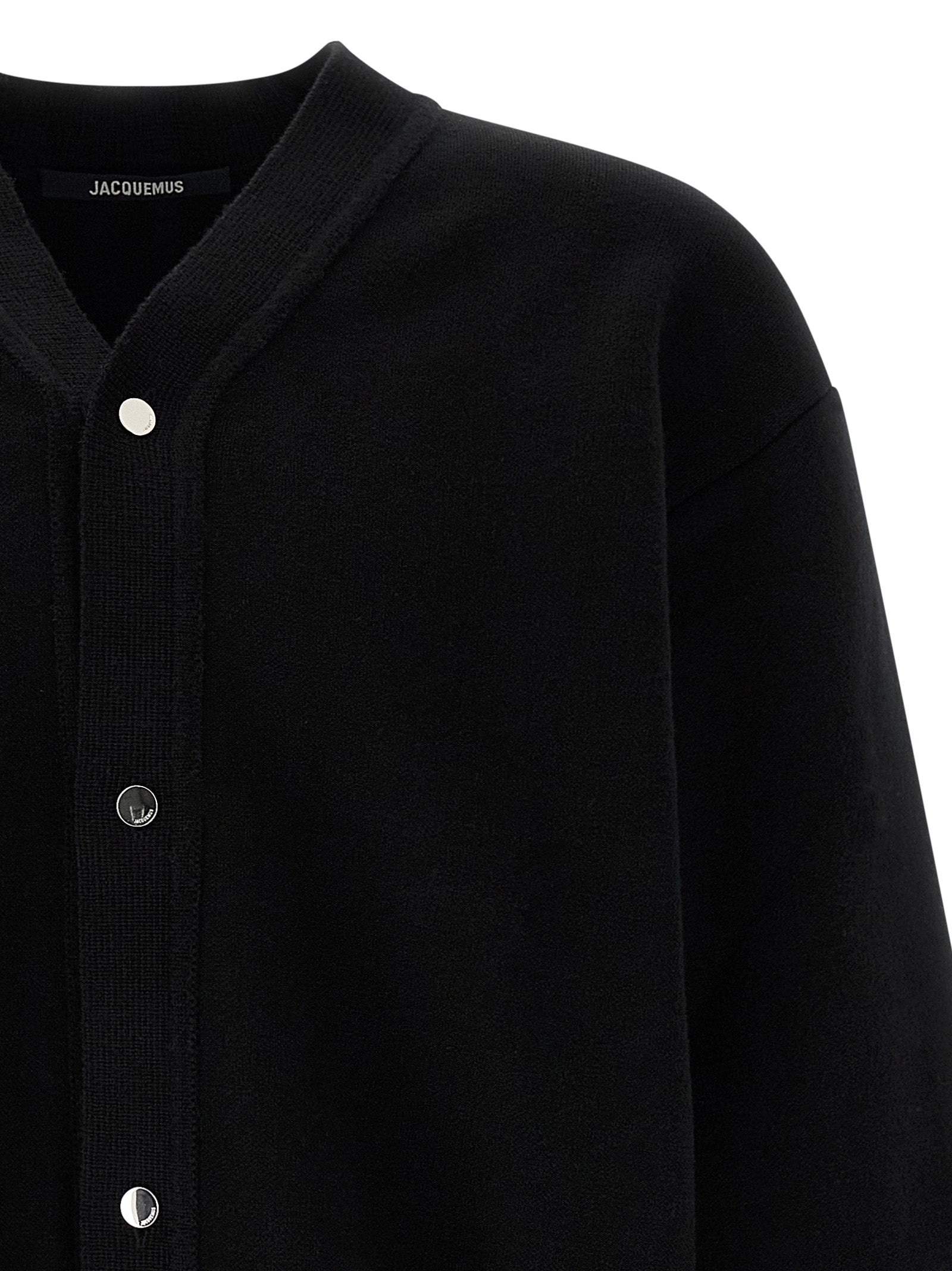 Cardigan by Jacquemus for men in polyamide & merino wool black features a nuanced silhouette with a refined v-neck neckline and nuanced detailing for a sophisticated look.