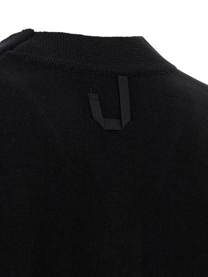 Cardigan by Jacquemus for men in polyamide & merino wool black showcases a luxurious silhouette, meticulously detailed with a sophisticated and for a refined finish.