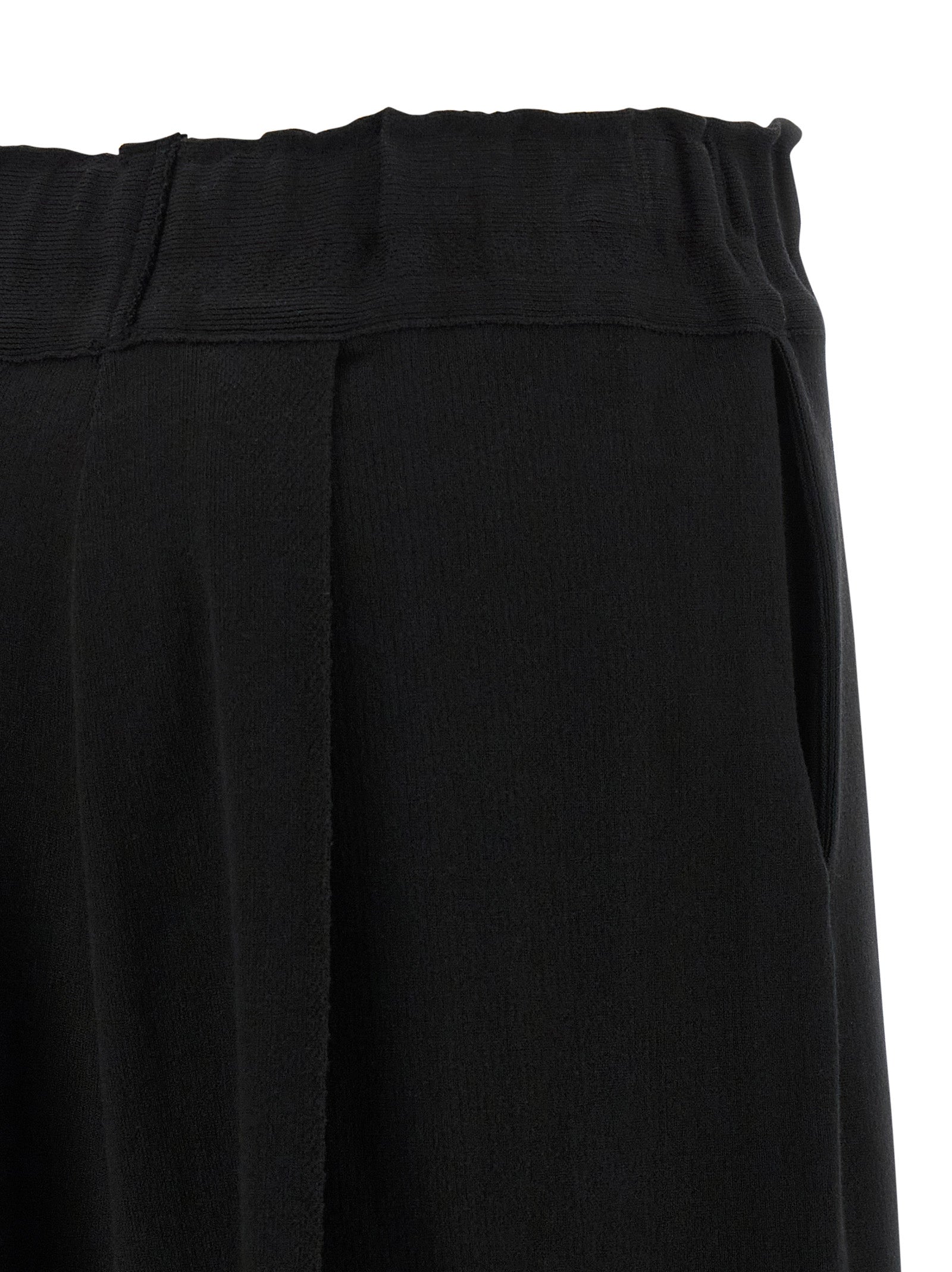Casual Pants by Issey Miyake for women in polyurethane & nylon black presents a tailored silhouette, showcasing a tailored wide and long cut with a refined for a truly tailored aesthetic.