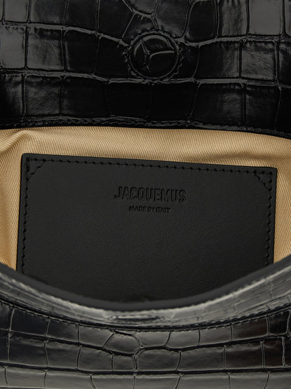 Shoulder Flap Bag by Jacquemus for women in croc skin bos taurus suede calf leather black & print features a effortless chic silhouette with a secure flap, magnetic & button, ample , and versatile shoulder-strap & handle for a effortless chic finish.