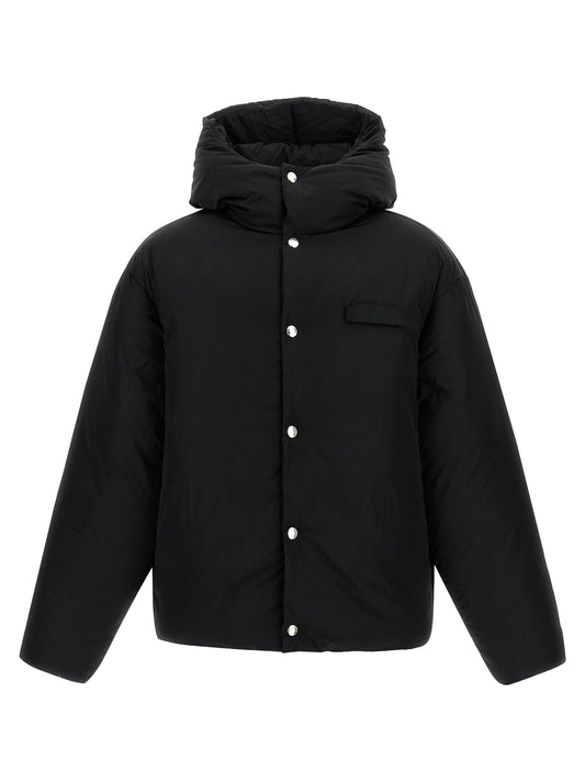 Hooded Puffer Jacket by Jacquemus for men in polyamide black features a dramatic silhouette, showcasing a sophisticated hooded high-neck neckline and distinctive hooded & insulated for a dramatic aesthetic.