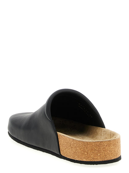 Clogs Flat Shoes by Balenciaga for men in cork & calfskin leather black features an captivating silhouette, showcasing the captivating style of the Men's Cork & Calfskin Leather Clogs Flat Shoes with its distinct and refined .