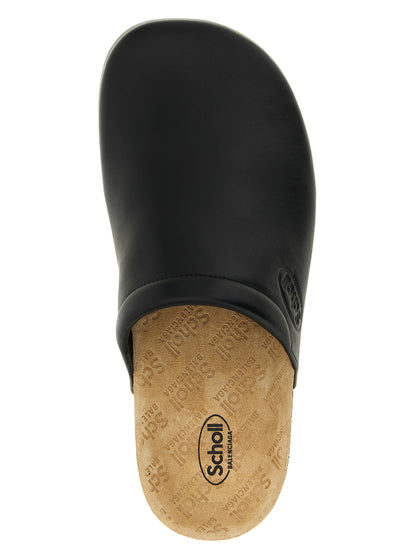 Clogs Flat Shoes by Balenciaga for men in cork & calfskin leather black showcases a dynamic silhouette, artfully capturing Men's Cork & Calfskin Leather Clogs Flat Shoes through its distinctive and elegant .