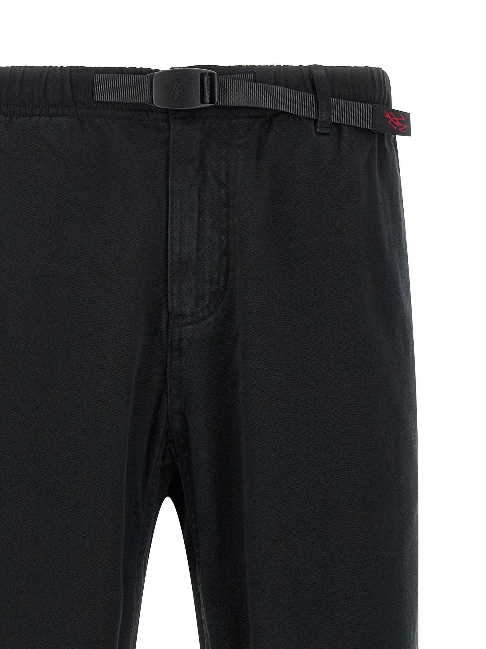 Trousers by Gramicci for men in organic cotton twill black presents a perennial silhouette, meticulously tailored with a wide cut, long finish, and an elegant .