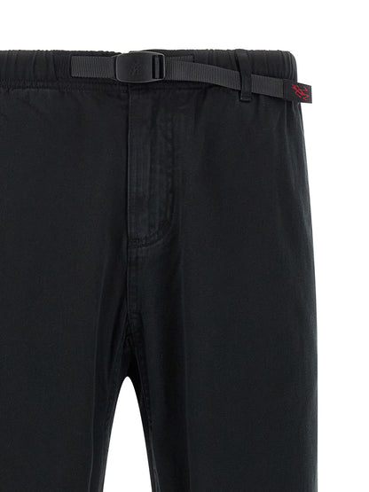 Trousers by Gramicci for men in organic cotton twill black presents a perennial silhouette, meticulously tailored with a wide cut, long finish, and an elegant .