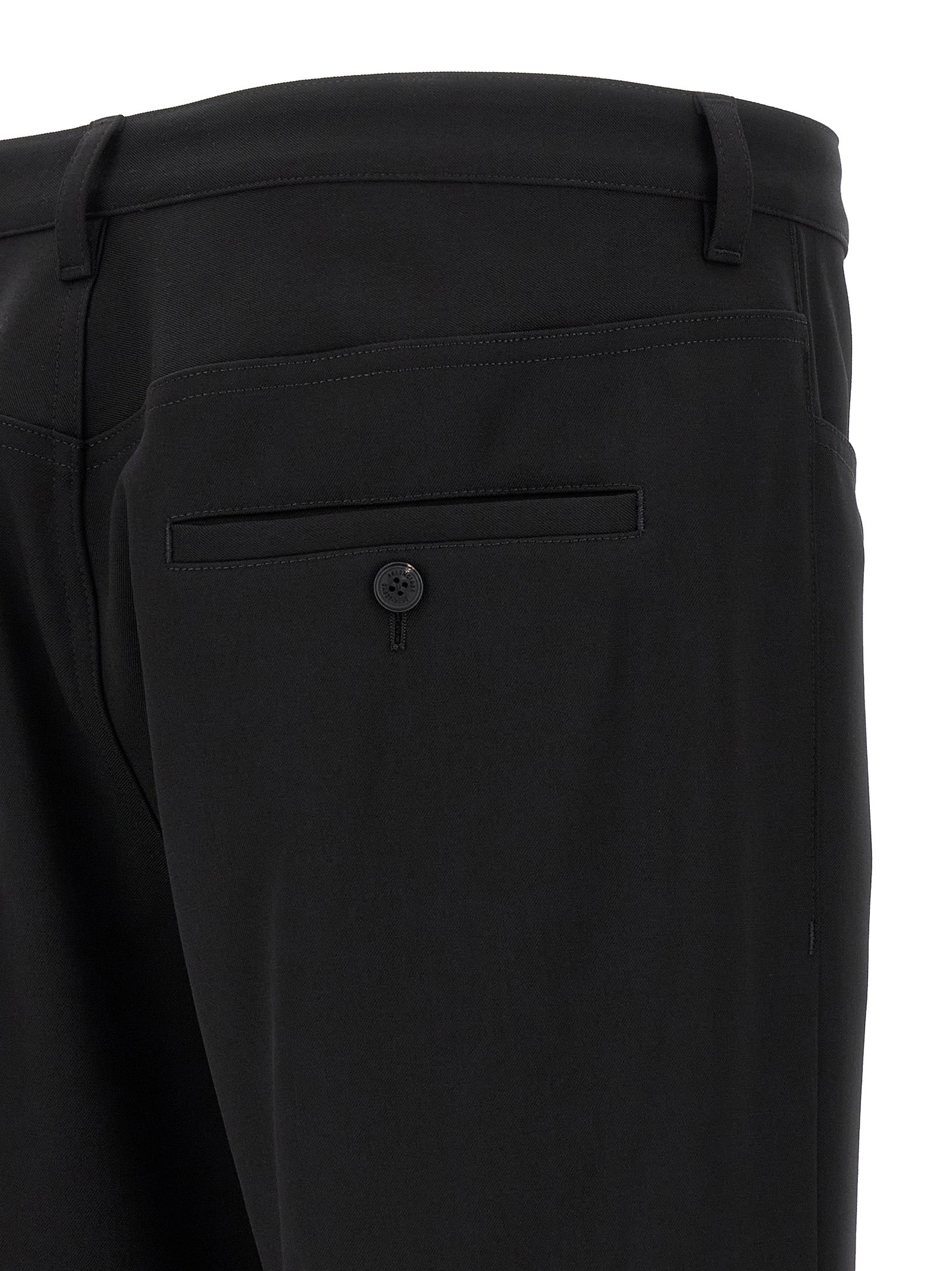Trousers by Balenciaga for men in wool twill black presents a perennial silhouette, meticulously tailored with a cut, long finish, and an elegant .