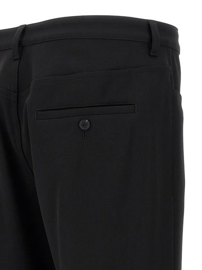 Trousers by Balenciaga for men in wool twill black presents a perennial silhouette, meticulously tailored with a cut, long finish, and an elegant .