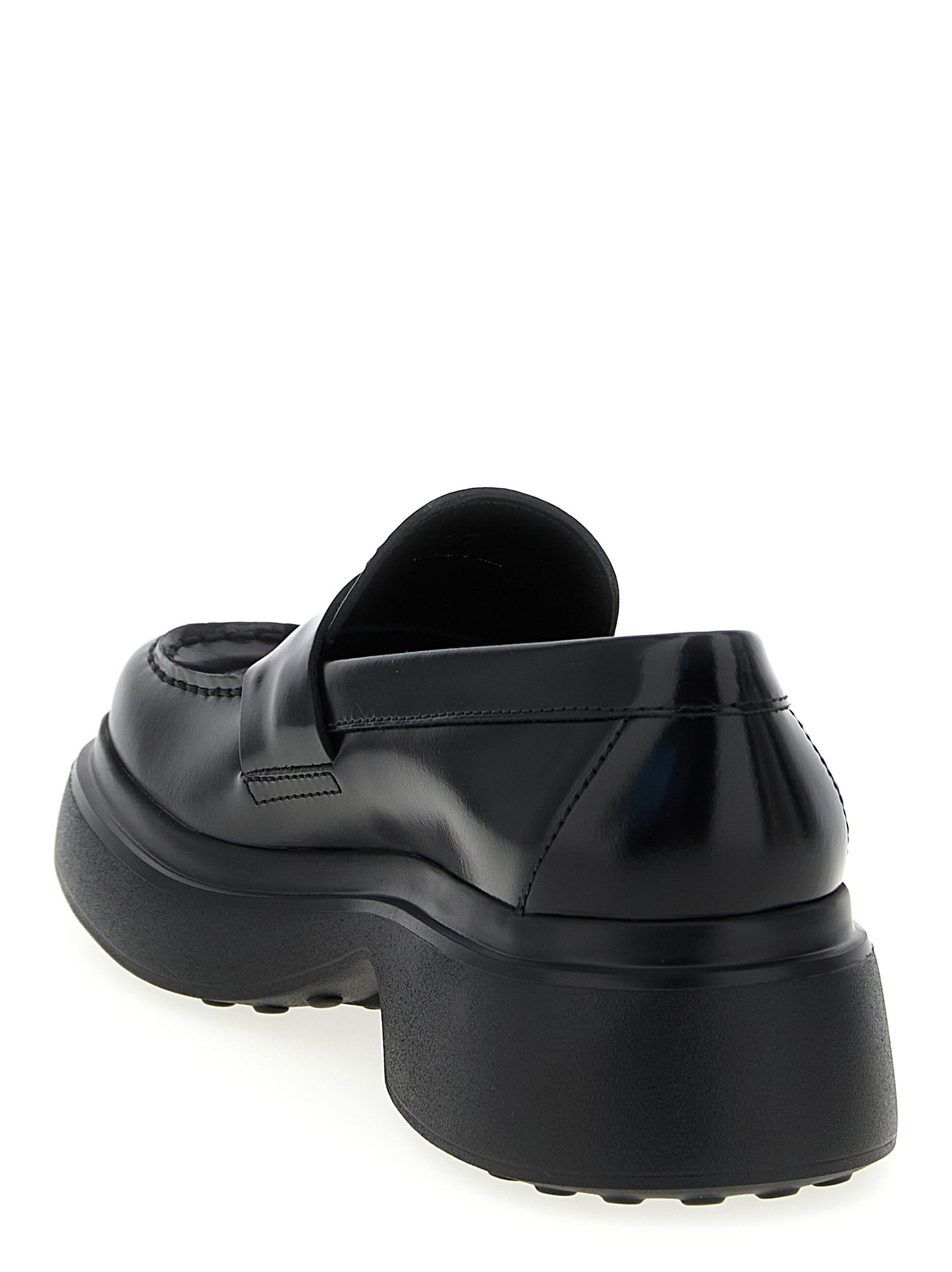 Flat Loafer Slip-On Shoes by Tod's for women in calfskin leather black showcases a impeccable silhouette as Women's Calfskin Leather Flat Loafer Slip-On Shoes, artfully designed with a impeccable flat and refined for a impeccable finish.