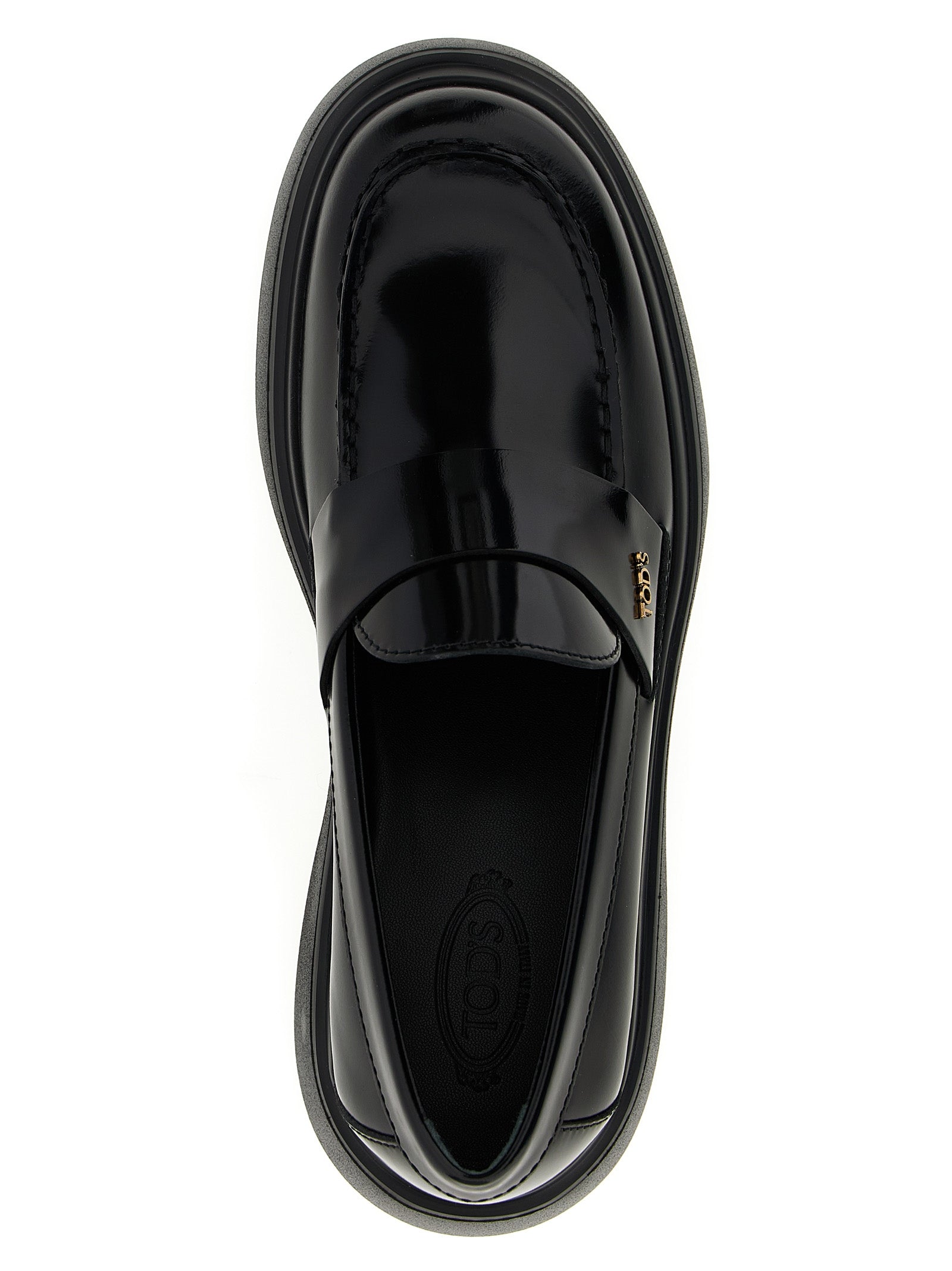 This Flat Loafer Slip-On Shoes by Tod's for women in calfskin leather black features an exquisite silhouette from the Women's Calfskin Leather Flat Loafer Slip-On Shoes collection, defined by a sophisticated flat and elegant .