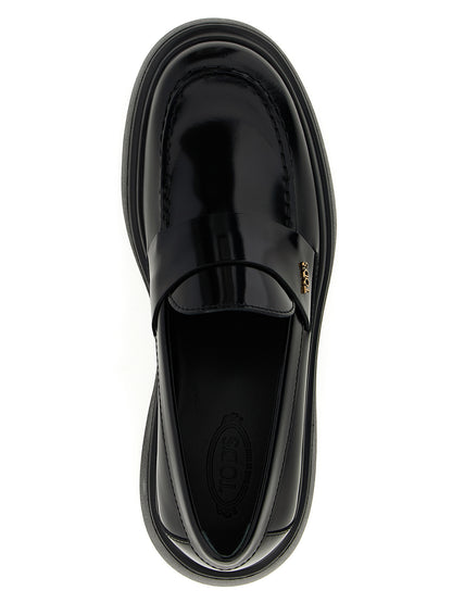 This Flat Loafer Slip-On Shoes by Tod's for women in calfskin leather black features an exquisite silhouette from the Women's Calfskin Leather Flat Loafer Slip-On Shoes collection, defined by a sophisticated flat and elegant .