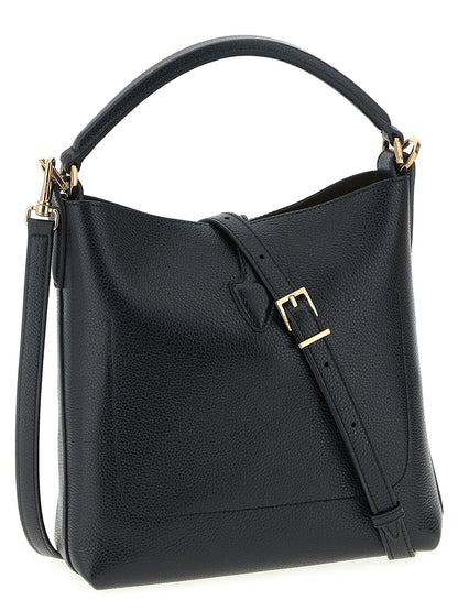Mini Bucket Handbag by Tod's for women in calfskin leather black presents a ornamental silhouette, showcasing a secure snap & button, ample , and versatile shoulder-strap, handle & adjustable-strap for a ornamental finish.