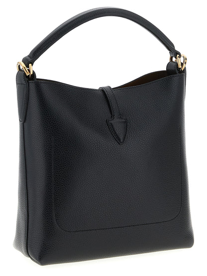 Mini Bucket Handbag by Tod's for women in calfskin leather black features a contemporary silhouette, showcasing a secure snap & button, ample , and contemporary shoulder-strap, handle & adjustable-strap for a sophisticated look.