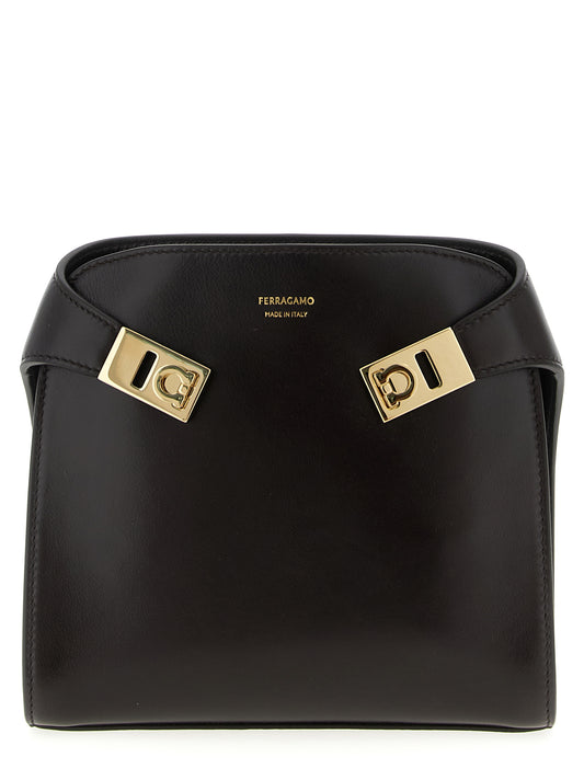 Crossbody Fanny Pack Handbag by Ferragamo for women in bos taurus suede calf leather brown features a transformative elegance silhouette, showcasing a secure flap, magnetic & buckle, organized , and versatile crossbody-strap, shoulder-strap & belt-strap for a transformative elegance look.