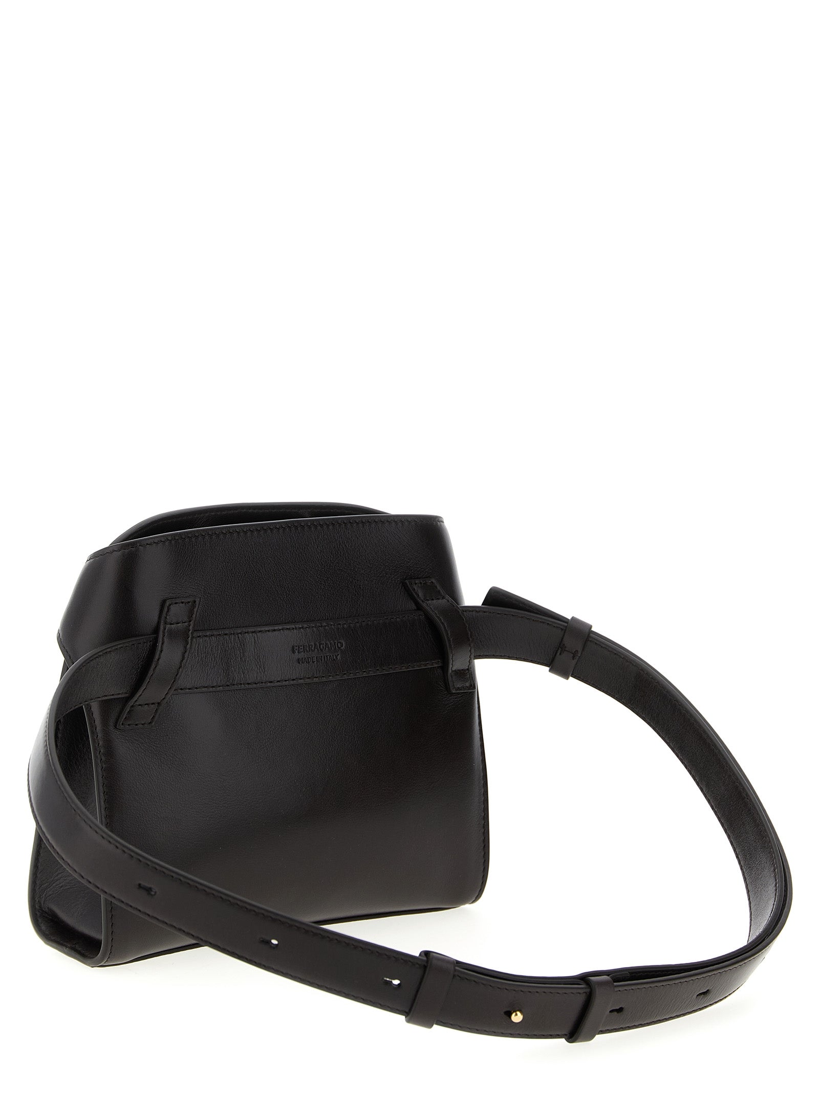 Crossbody Fanny Pack Handbag by Ferragamo for women in bos taurus suede calf leather brown features a transformative sophistication silhouette, showcasing a secure flap, magnetic & buckle, ample , and versatile crossbody-strap, shoulder-strap & belt-strap for a transformative sophistication look.
