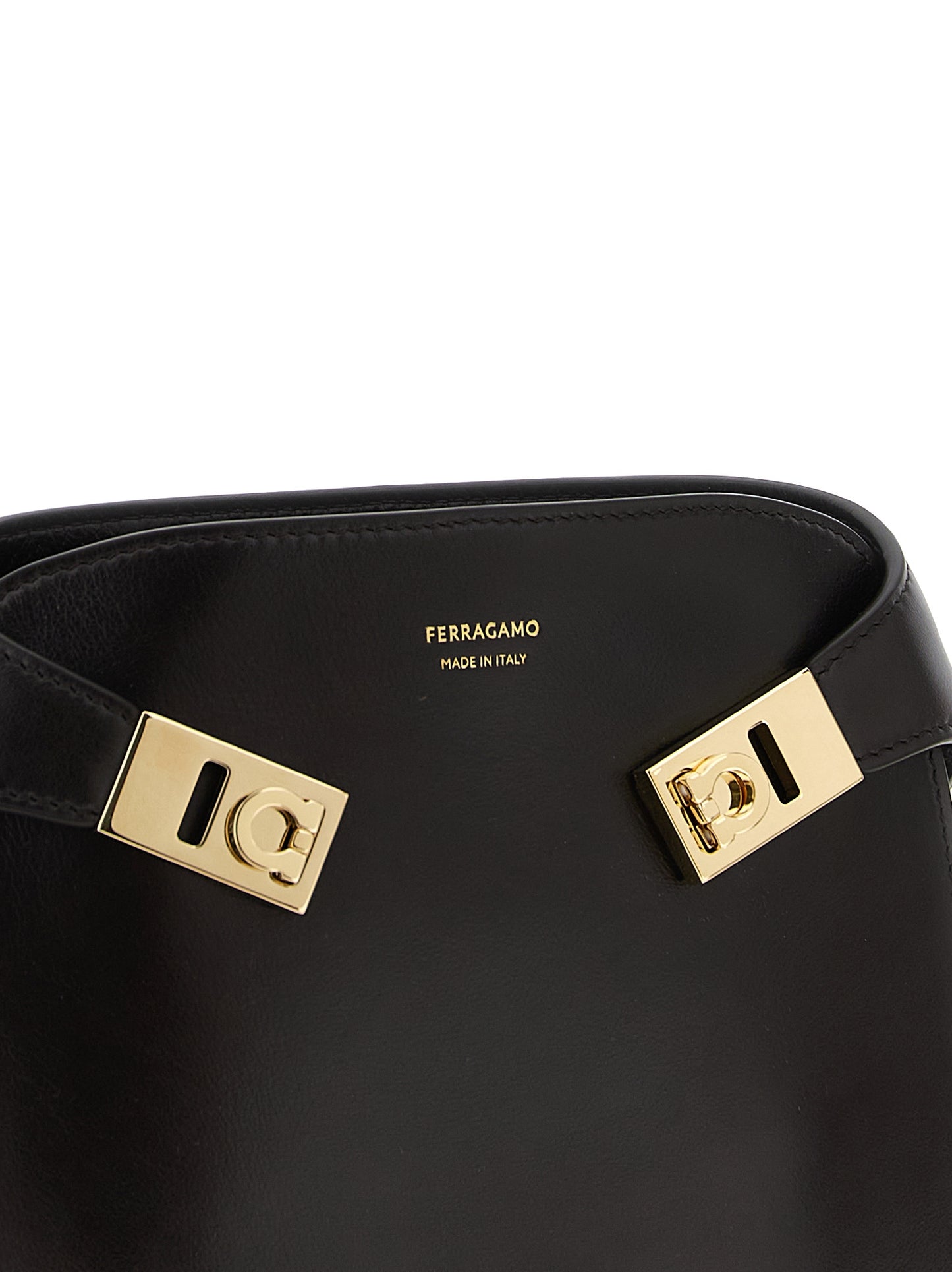 Crossbody Fanny Pack Handbag by Ferragamo for women in bos taurus suede calf leather brown features an versatile silhouette, showcasing a secure flap, magnetic & buckle and versatile with versatile crossbody-strap, shoulder-strap & belt-strap for a versatile finish.