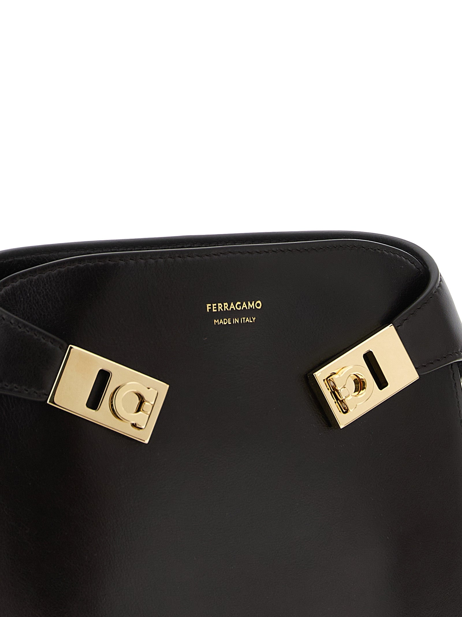 Crossbody Fanny Pack Handbag by Ferragamo for women in bos taurus suede calf leather brown features an versatile silhouette, showcasing a secure flap, magnetic & buckle and versatile with versatile crossbody-strap, shoulder-strap & belt-strap for a versatile finish.