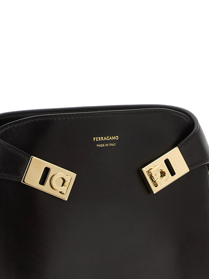 Crossbody Fanny Pack Handbag by Ferragamo for women in bos taurus suede calf leather brown features an versatile silhouette, showcasing a secure flap, magnetic & buckle and versatile with versatile crossbody-strap, shoulder-strap & belt-strap for a versatile finish.