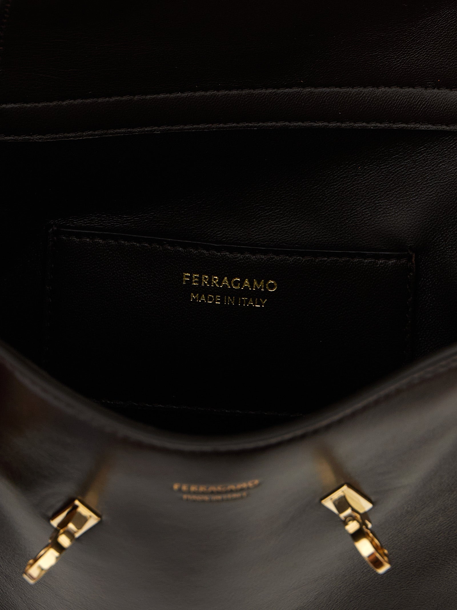 Crossbody Fanny Pack Handbag by Ferragamo for women in bos taurus suede calf leather brown features a versatile chic silhouette, meticulously detailed with a secure flap, magnetic & buckle, ample , and versatile crossbody-strap, shoulder-strap & belt-strap.
