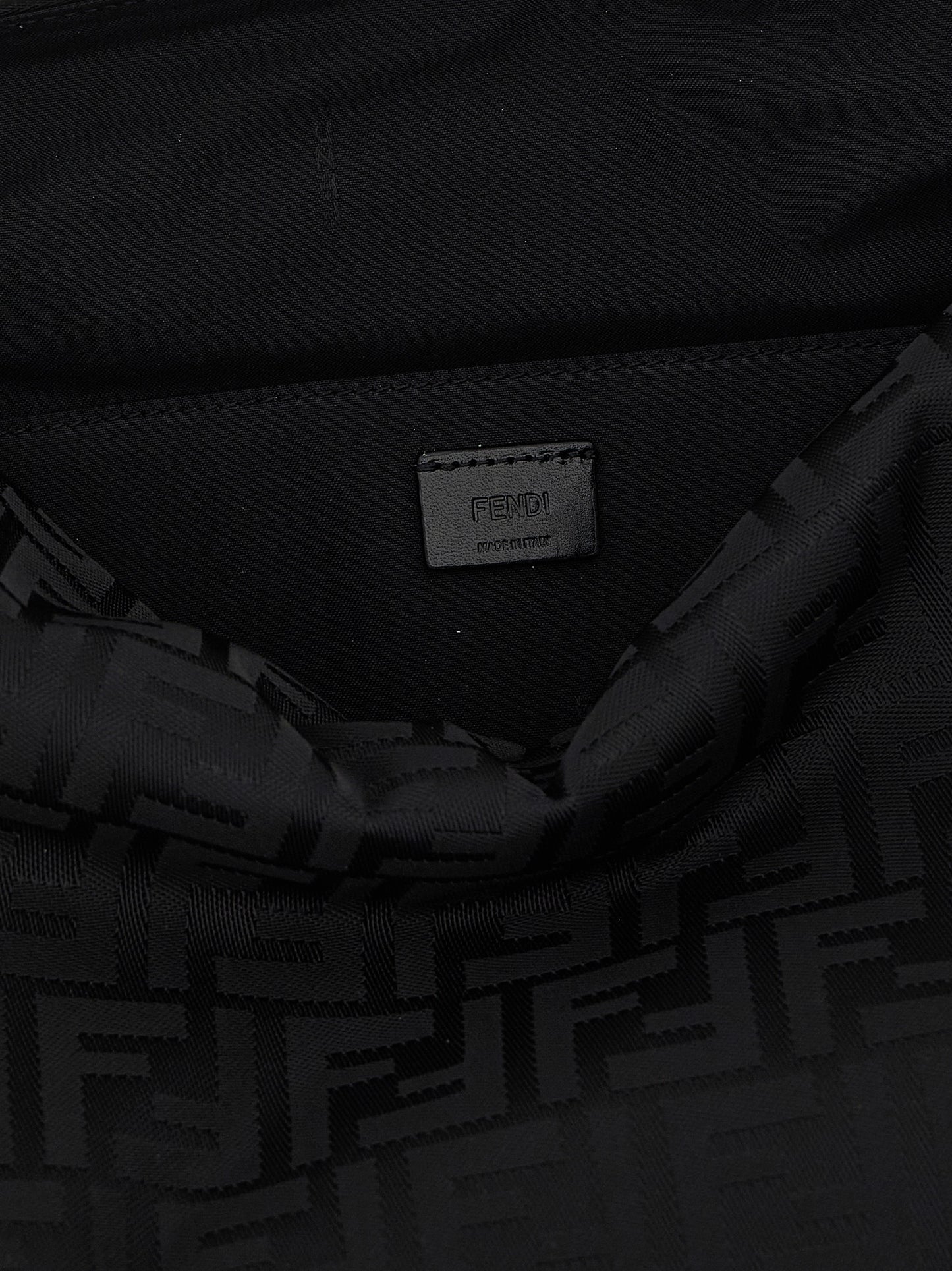 Large Shoulder Bag by Fendi for men in calf leather & poly nylon black features an effortlessly chic silhouette with a secure zipper, ample , and versatile shoulder-strap, adjustable-strap, detachable-strap & handle for effortlessly chic everyday luxury.
