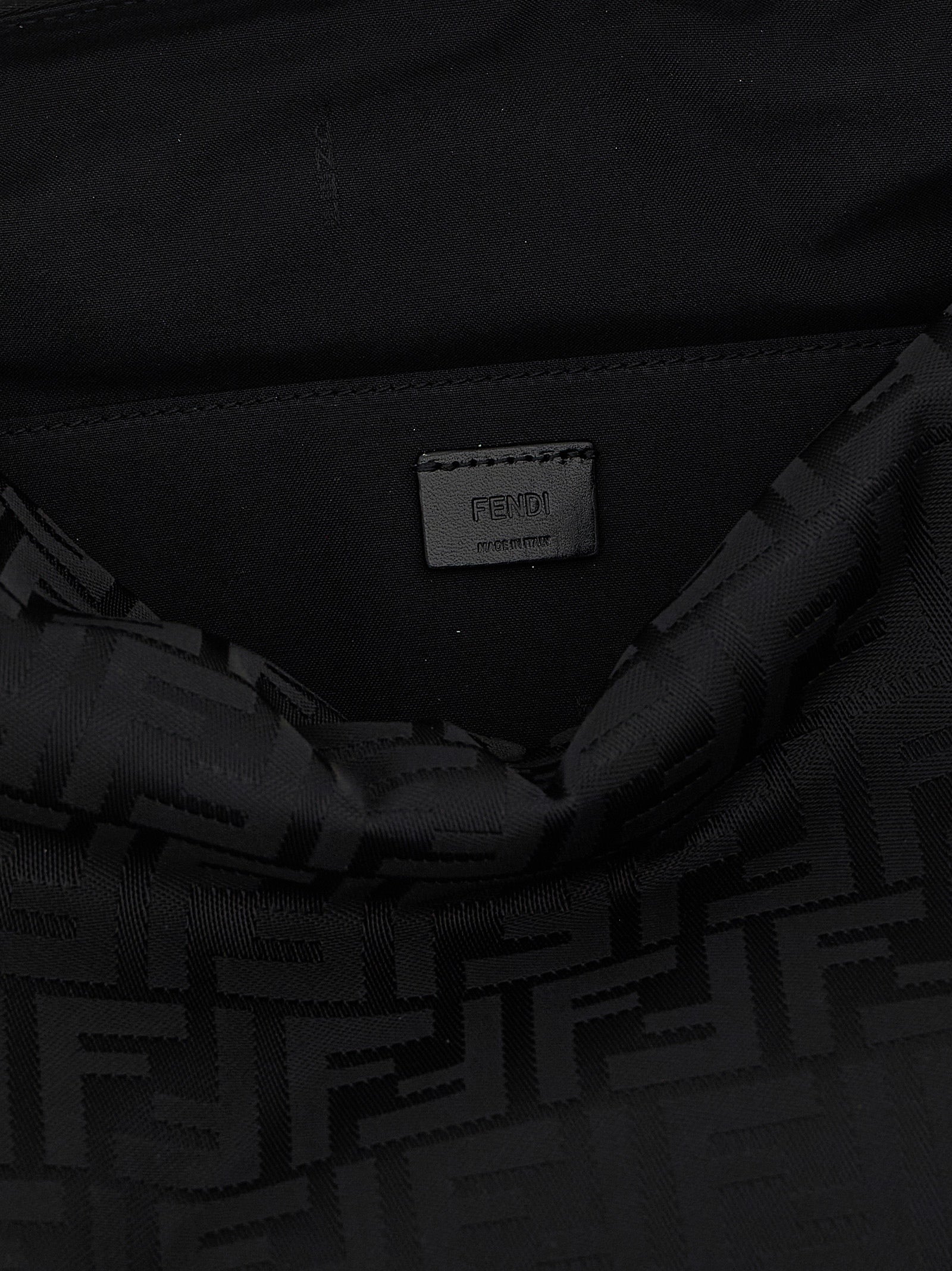 Large Shoulder Bag by Fendi for men in calf leather & poly nylon black features an effortlessly chic silhouette with a secure zipper, ample , and versatile shoulder-strap, adjustable-strap, detachable-strap & handle for effortlessly chic everyday luxury.