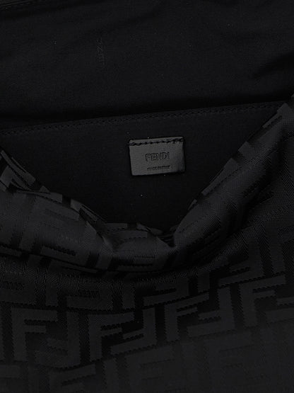 Large Shoulder Bag by Fendi for men in calf leather & poly nylon black features an effortlessly chic silhouette with a secure zipper, ample , and versatile shoulder-strap, adjustable-strap, detachable-strap & handle for effortlessly chic everyday luxury.
