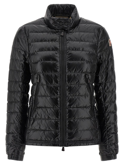 Puffer Jacket by Moncler Grenoble for women in nylon & goose-down black & signature features a dramatic silhouette, showcasing a sophisticated high-neck neckline and distinctive insulated for a dramatic aesthetic.
