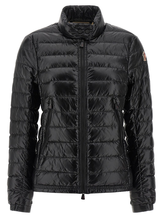 This Puffer Jacket by Moncler Grenoble for women in nylon & goose-down black & signature exhibits a edgy silhouette, meticulously detailed with functional insulated and a edgy high-neck neckline for a edgy finish.