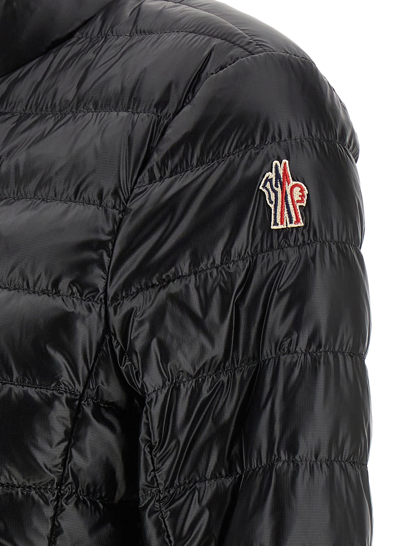 Puffer Jacket by Moncler Grenoble for women in nylon & goose-down black & signature presents a effortlessly chic silhouette, showcasing a sophisticated and premium insulated for a truly effortlessly chic finish.