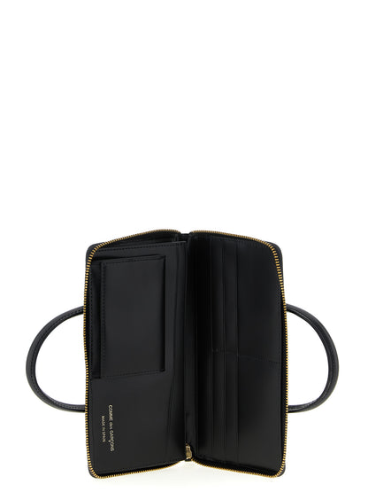 Cardholder Card Case by Comme Des Garçons for unisex in leather black features a sleek silhouette, showcasing the sleek design of the Leather Cardholder Card Case with functional card-organization for a premium look.