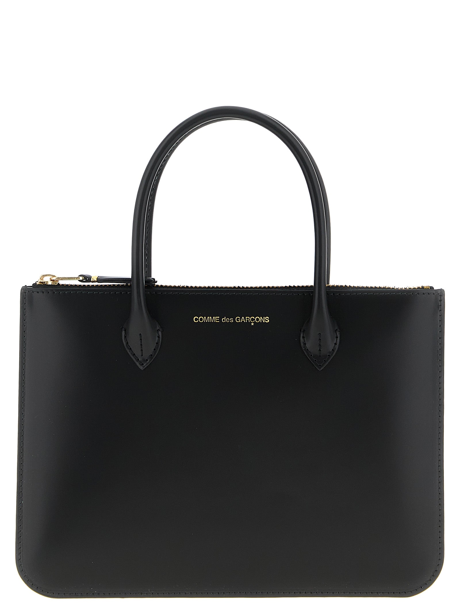 Handbag by Comme Des Garçons for unisex in leather black features an refined silhouette, showcasing a secure zipper, ample , and versatile handle for a sophisticated refined aesthetic.