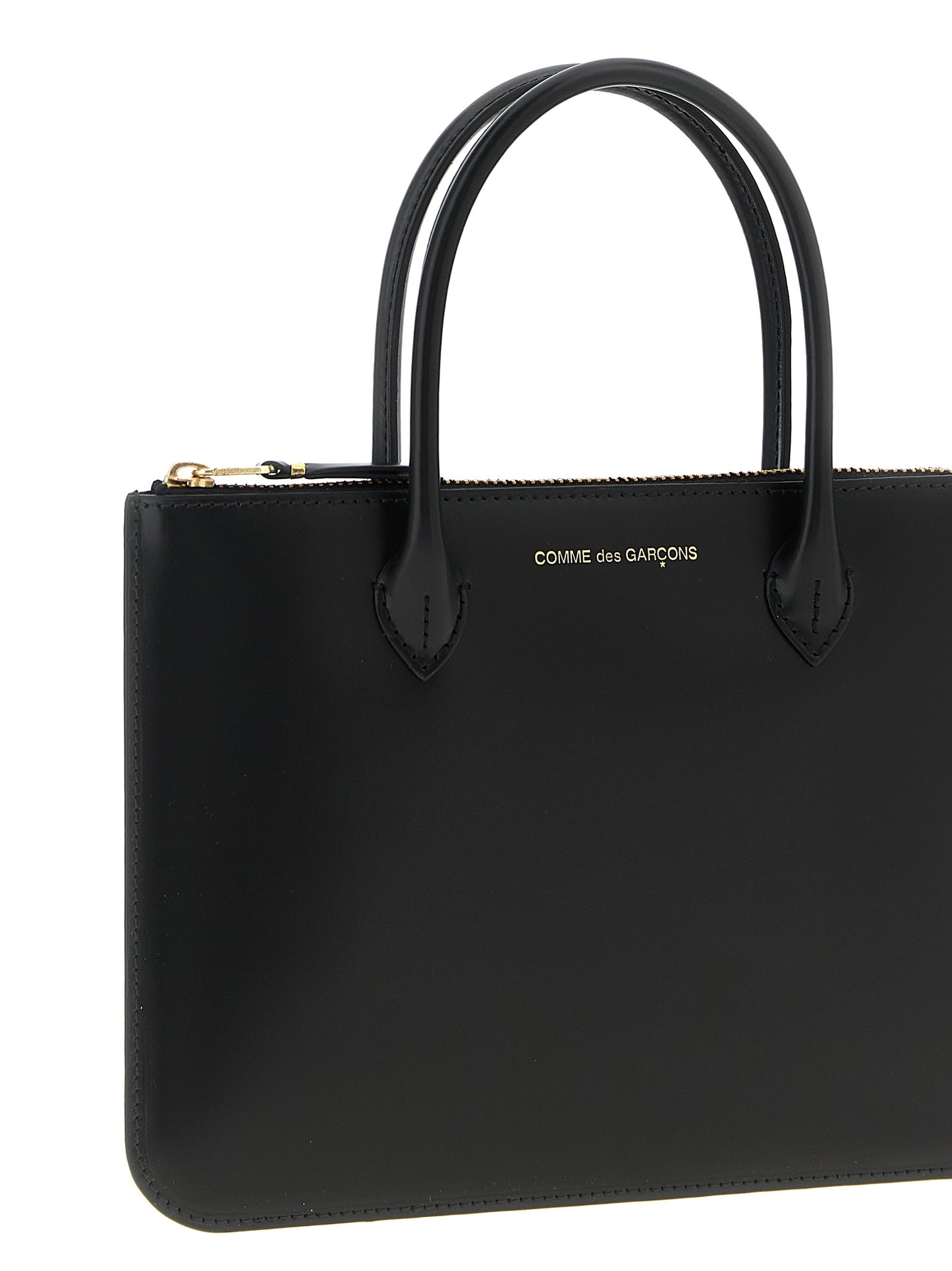 Handbag by Comme Des Garçons for unisex in leather black features a refined silhouette, showcasing a secure zipper, organized , and versatile handle for a refined finish.